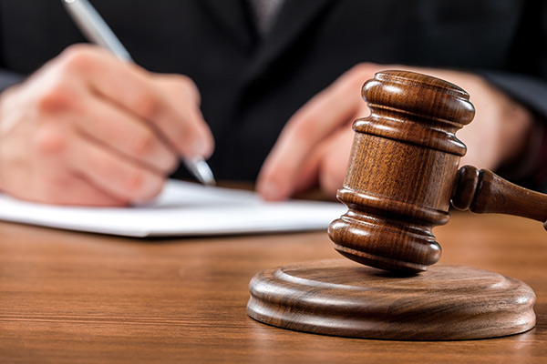 Barclays banker accused of beating deaf assistant with bat 
