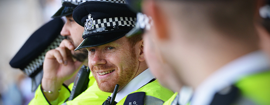 Gun-carrying UK police officers respond to criticism with #SmileForTheBBC