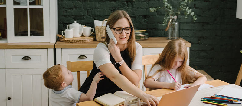 Working mom multitasking with children