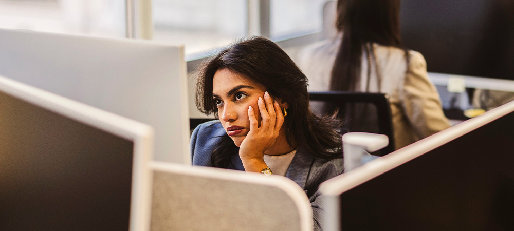 Bored woman at office desk