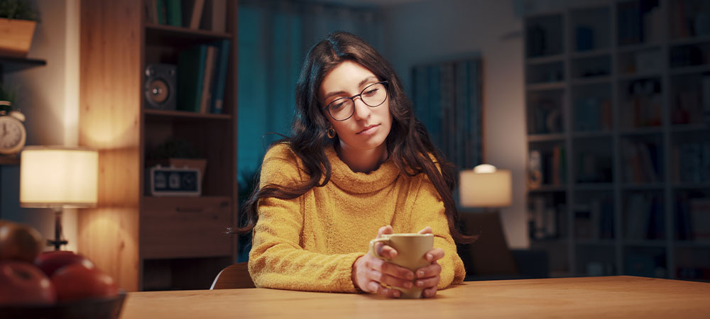 Woman feeling lonely at home