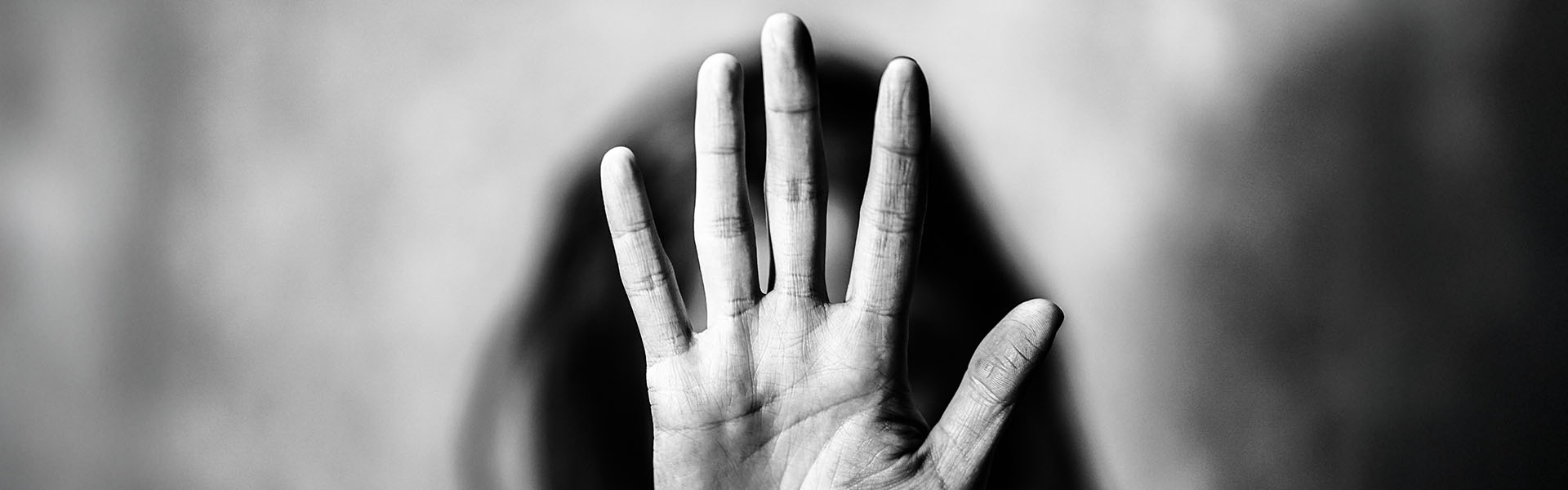 Stop hand gesture black background