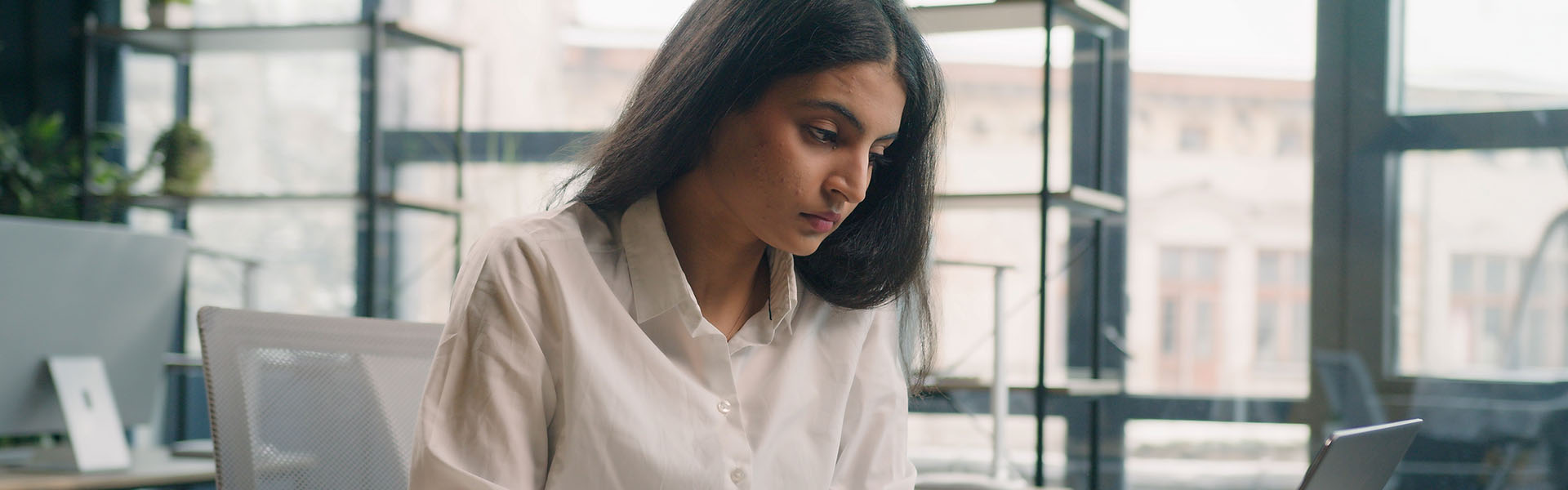 Focused woman working in office