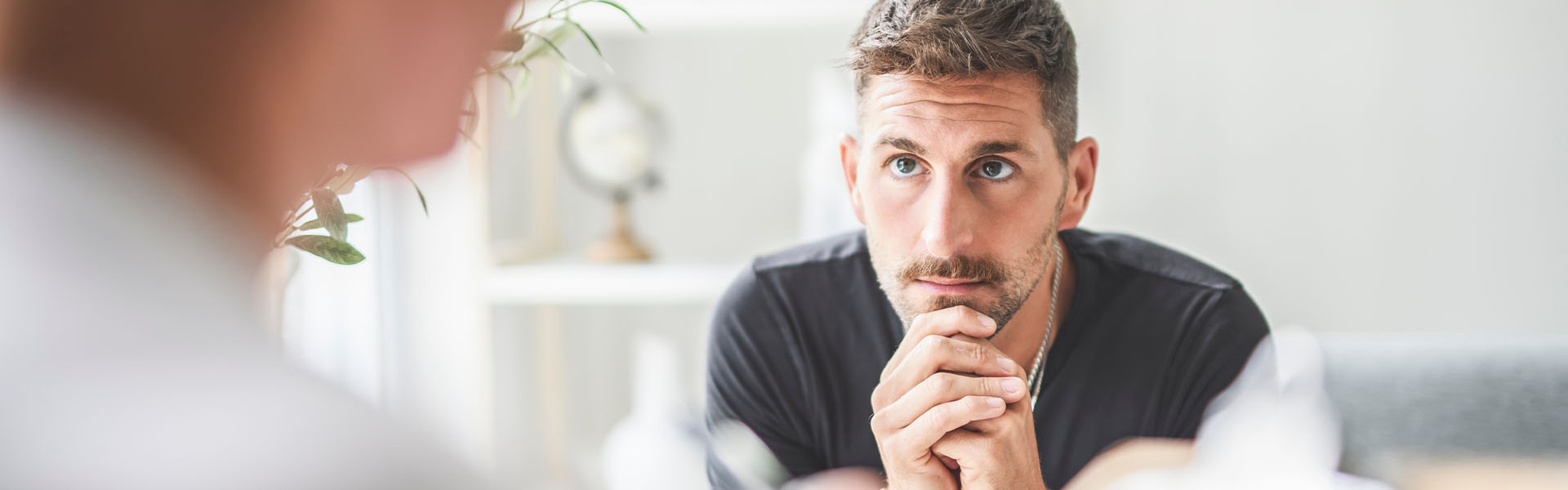Man listening during therapy session