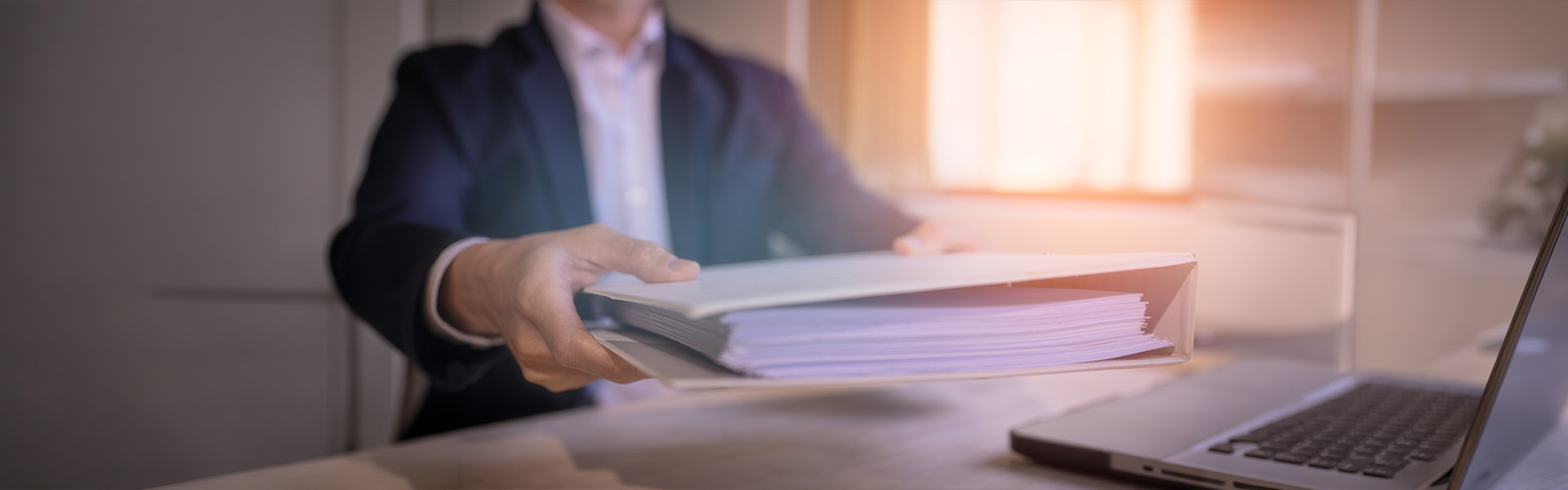 Businessman handing over documents