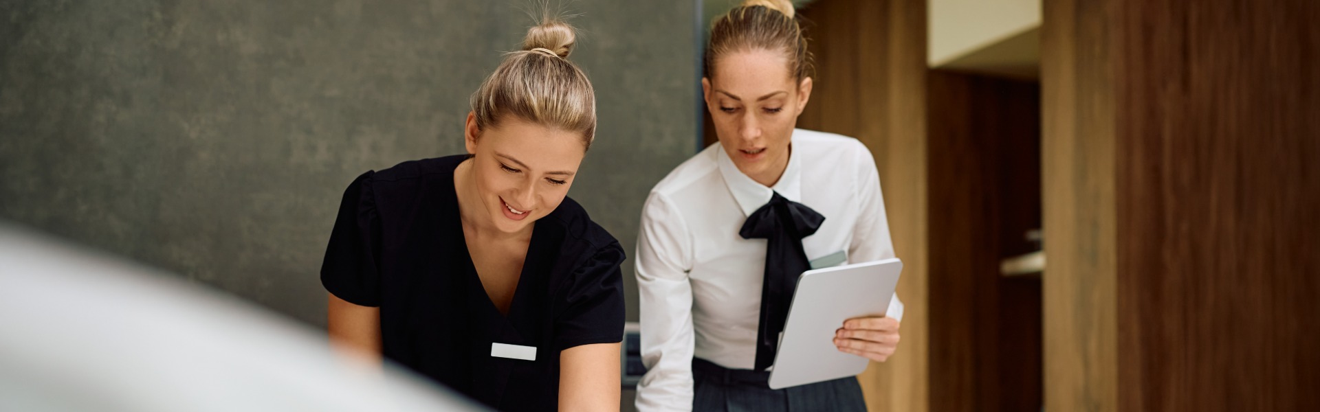 Hotel staff member receiving training in a suite