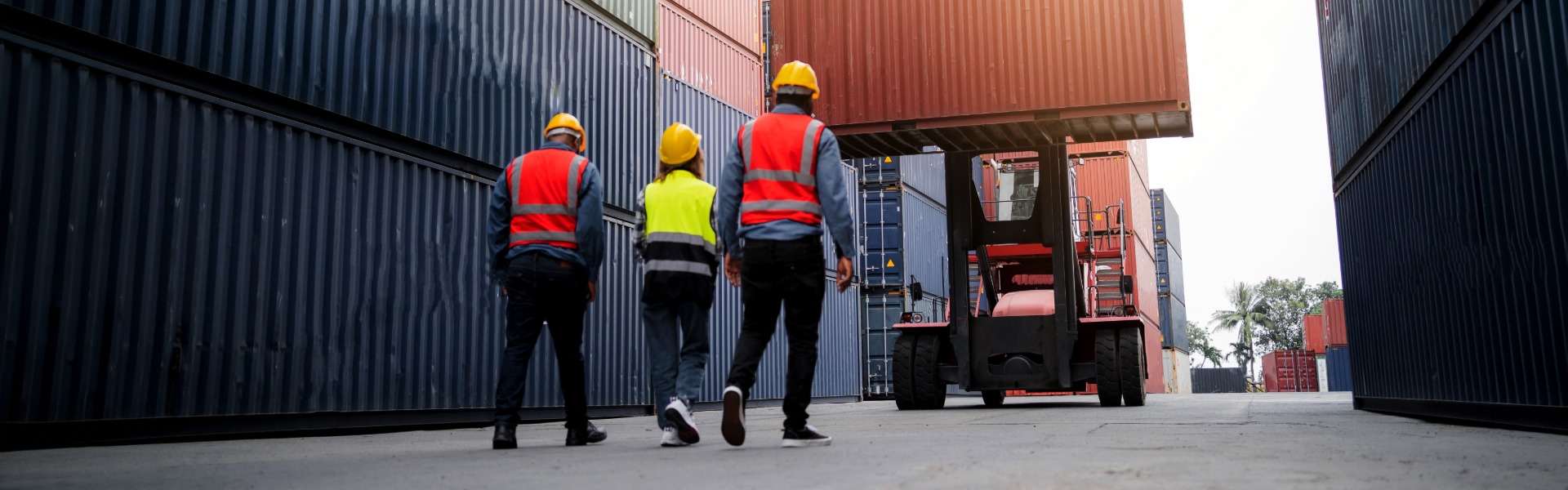 Workers at shipping container yard