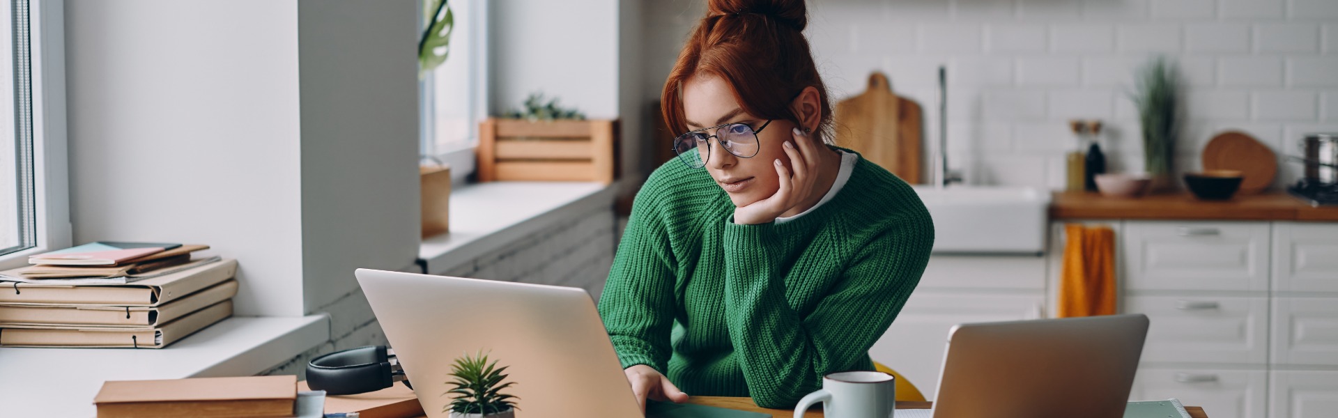 Woman working remotely with laptops