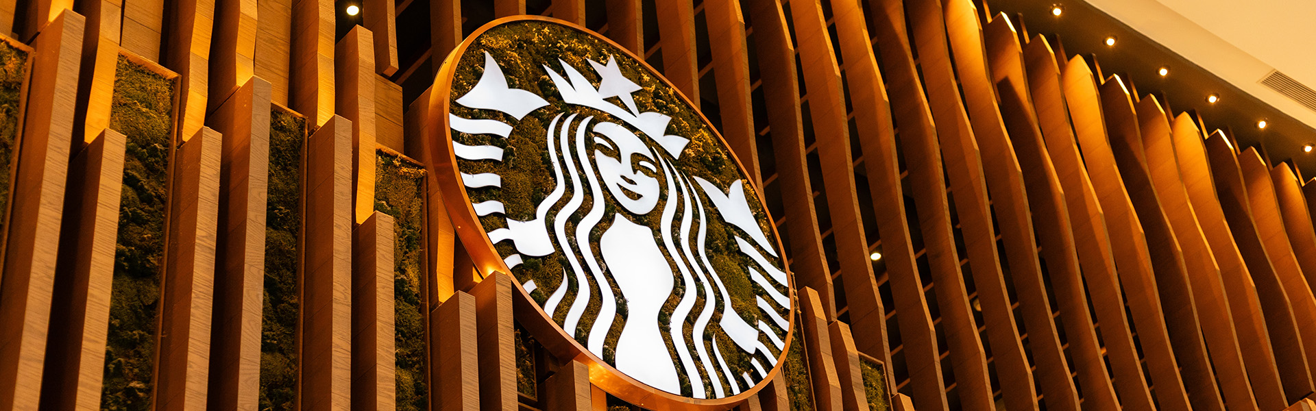 Starbucks logo on wooden wall
