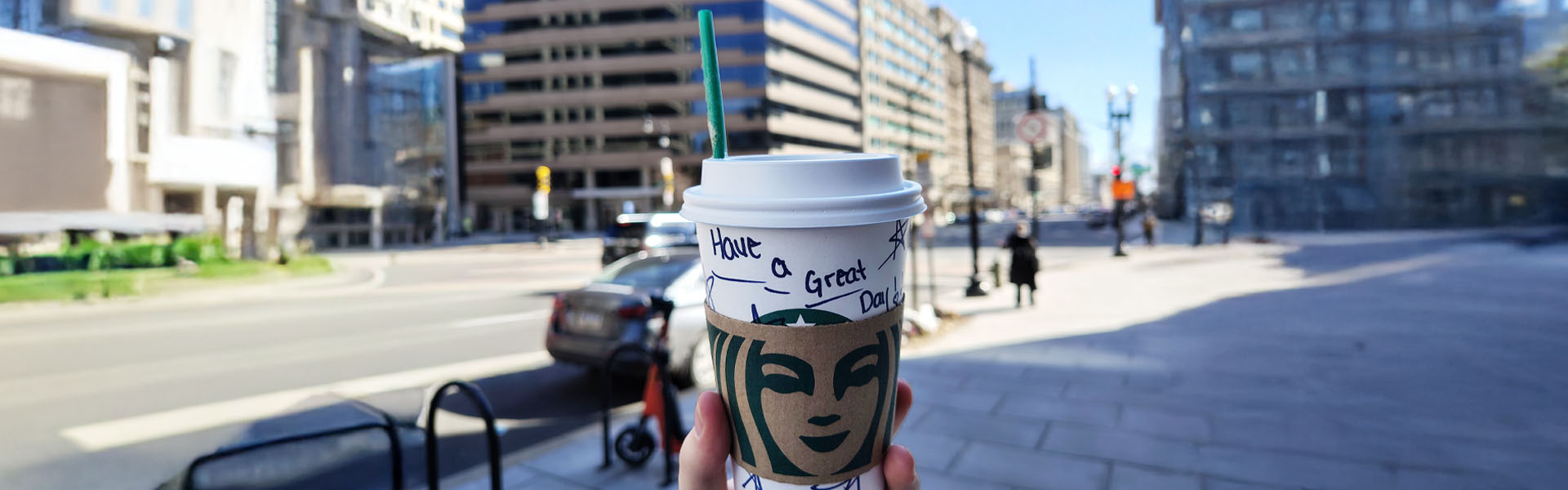 Starbucks coffee cup city street