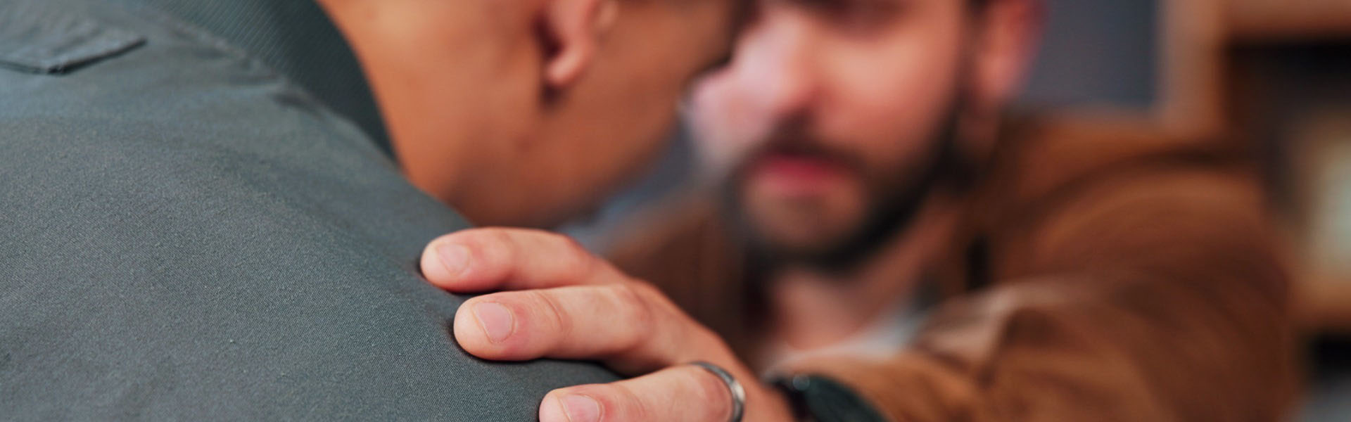 Man comforting friend with empathy