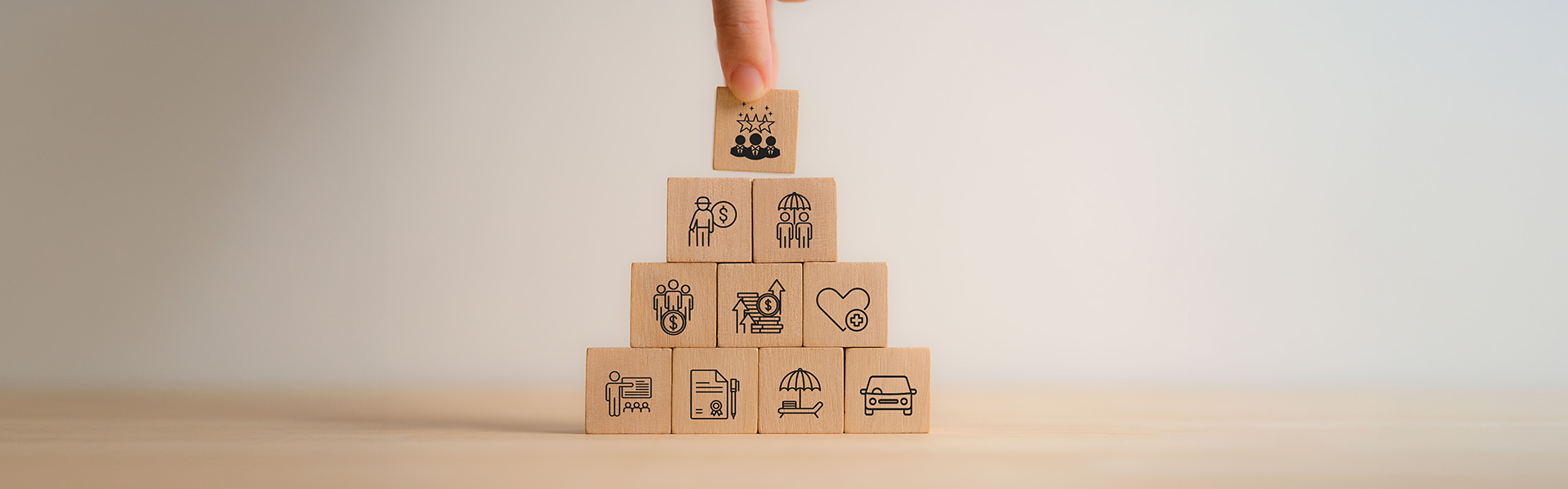 Business success pyramid wooden blocks