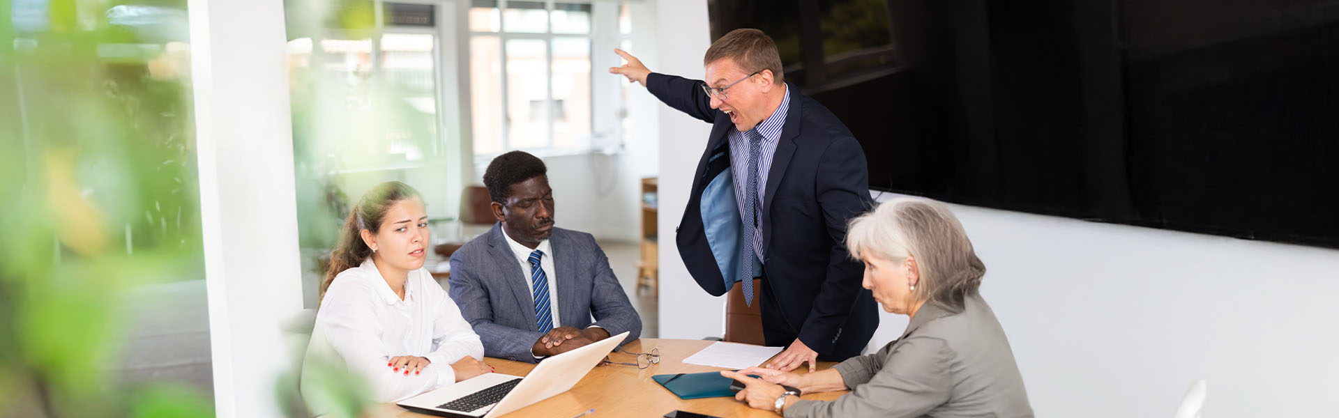 Angry boss yelling at employees