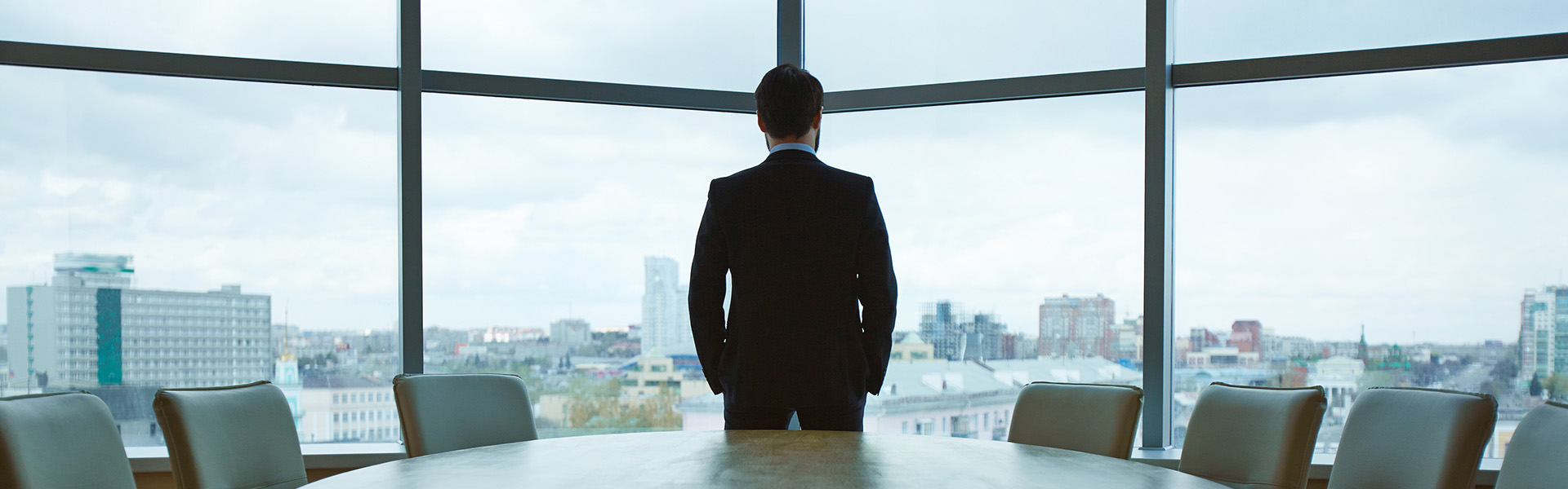 Businessman overlooking city office view