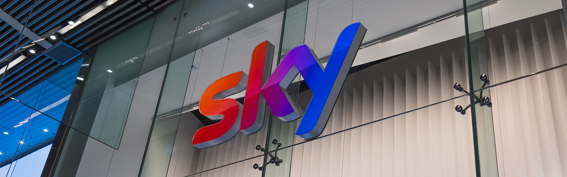 Sky logo on glass building