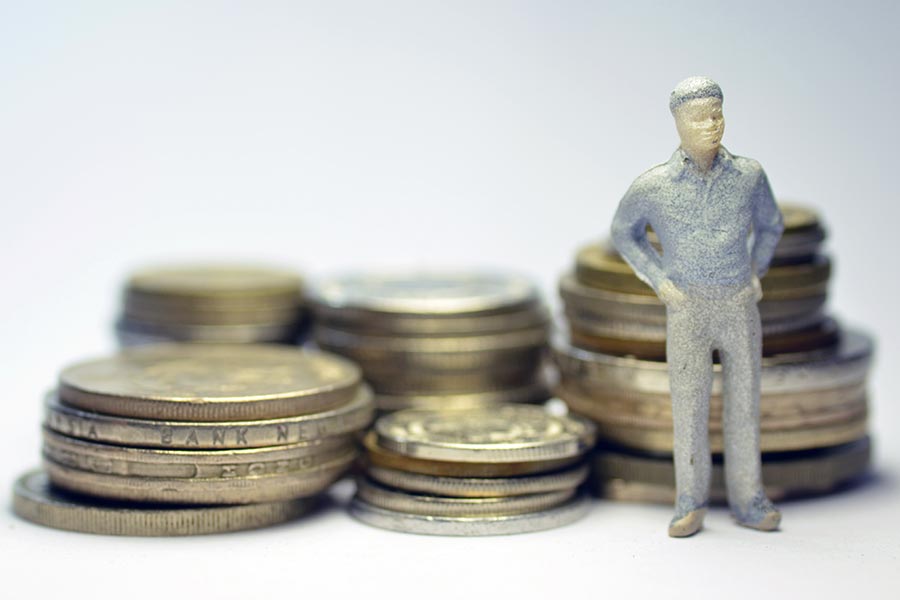 What are the issues with making the living wage a reality?