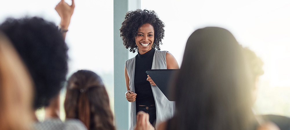 Smiling woman leading business presentation