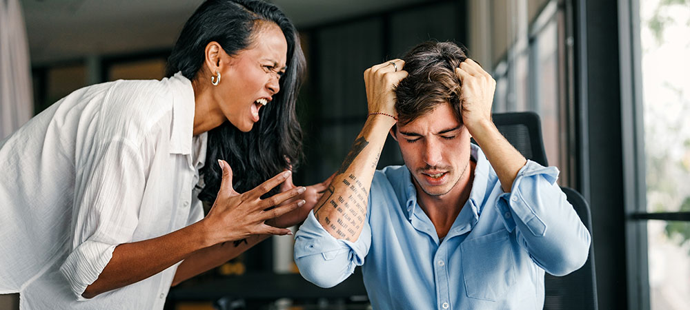 Woman yelling at stressed man