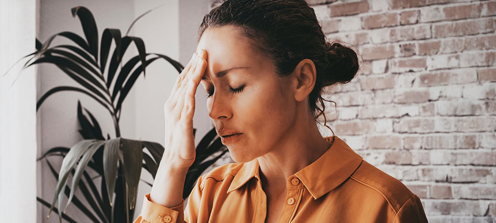 Woman overwhelmed at work