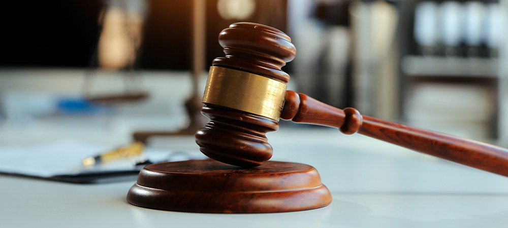 Judge’s gavel on courtroom table
