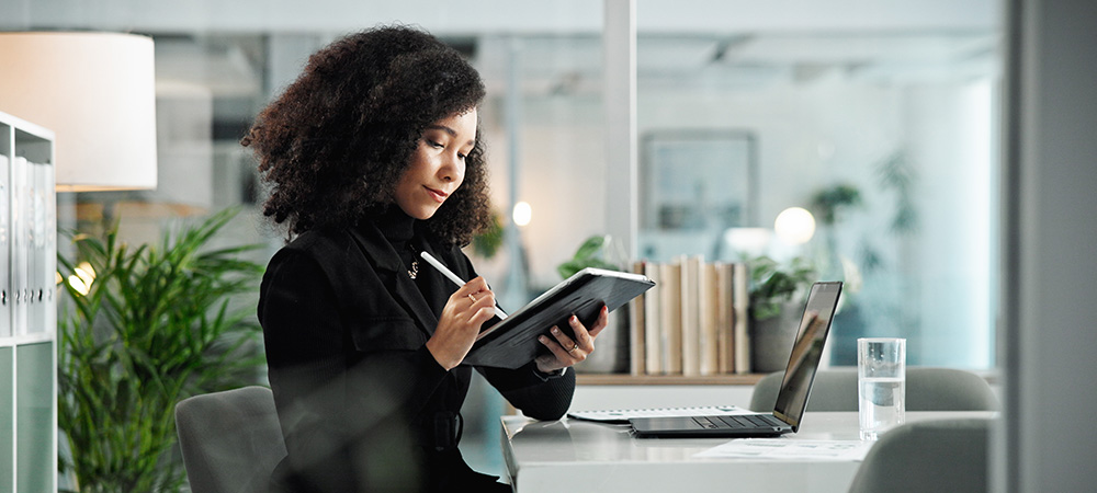 Businesswoman working on digital tablet