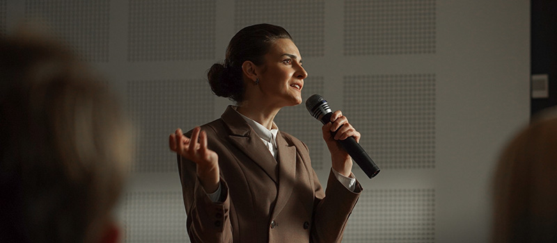 Businesswoman speaking at conference