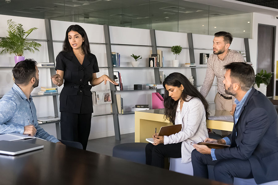 Your business doesn't need another change management model, just leaders who care Team meeting discussing business strategy