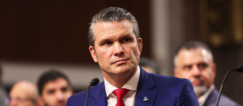 Man in suit speaking publicly