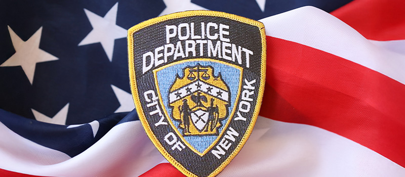 NYPD badge on American flag