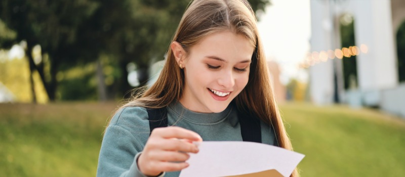 Happy student receiving results letter