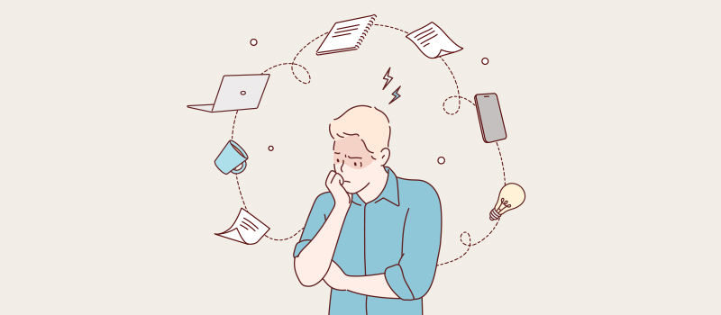 Stressed man surrounded by tasks
