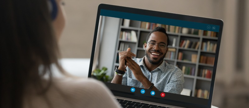 Video call with smiling man