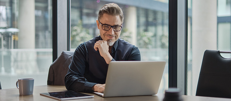 Businessman working on laptop desk