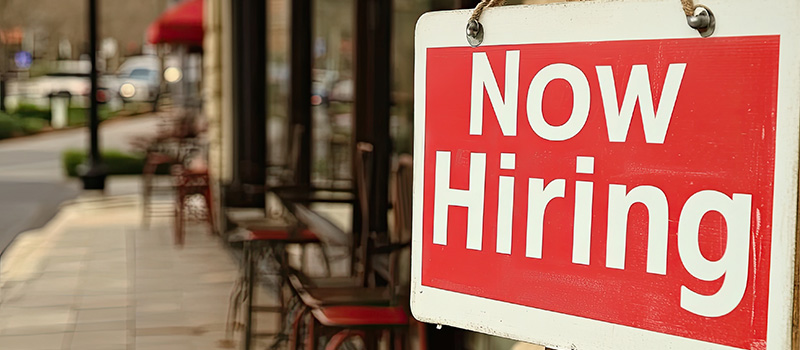 Now hiring sign outside business