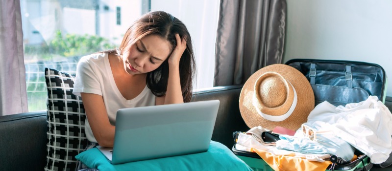 Stressed woman planning travel itinerary