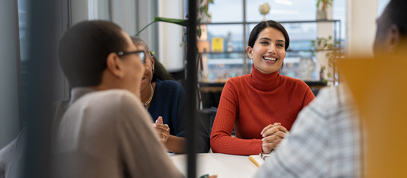 Smiling team in office meeting