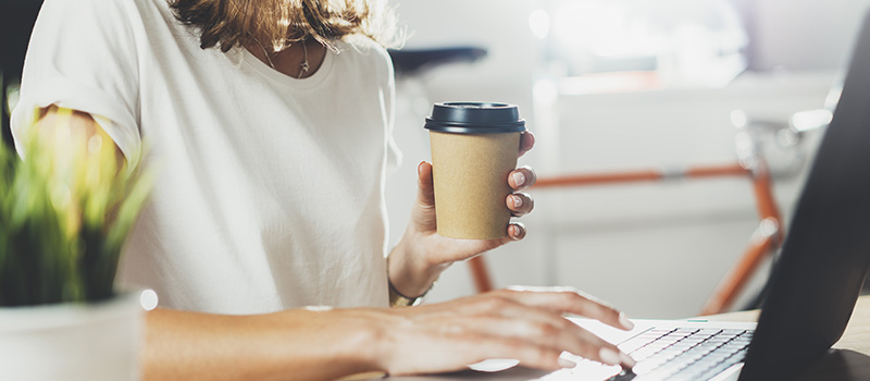 Woman working with coffee cup