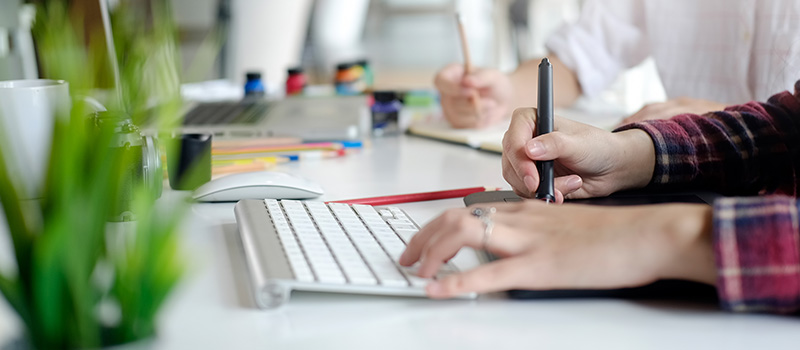 Graphic designer working at desk