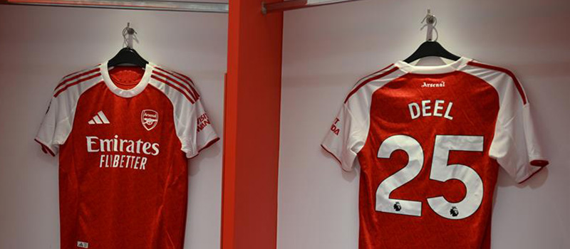 Arsenal football jerseys in locker.