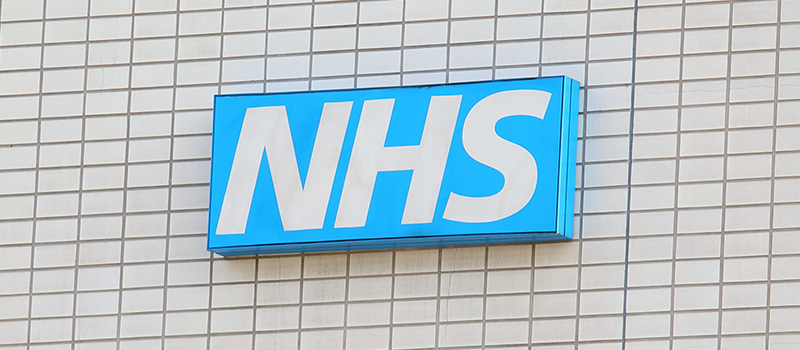 NHS logo on hospital building