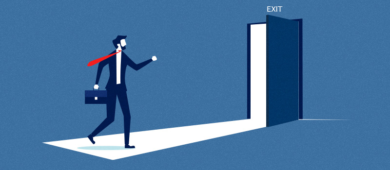 Businessman walking towards exit door
