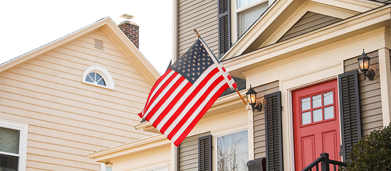 American flag on suburban house