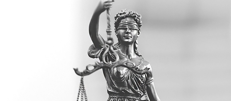 Blindfolded Lady Justice holding scales