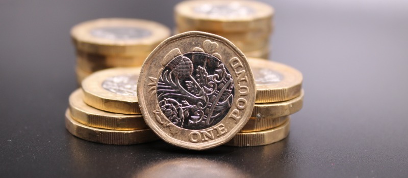 British one pound coins stacked