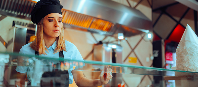 Female chef working in kitchen
