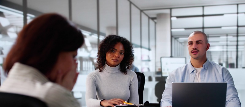 Job interview panel questioning candidate