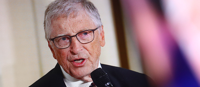 Bill Gates speaking into microphone