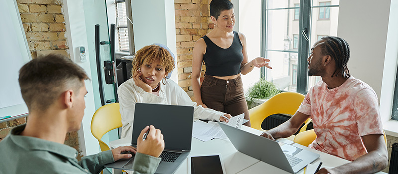 Gen Z team collaborating in office