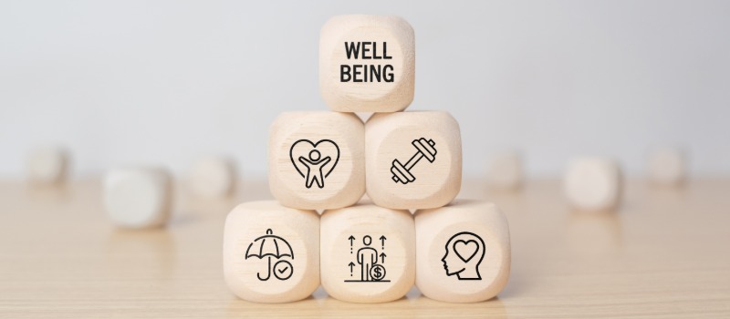 Well-being icons on wooden blocks