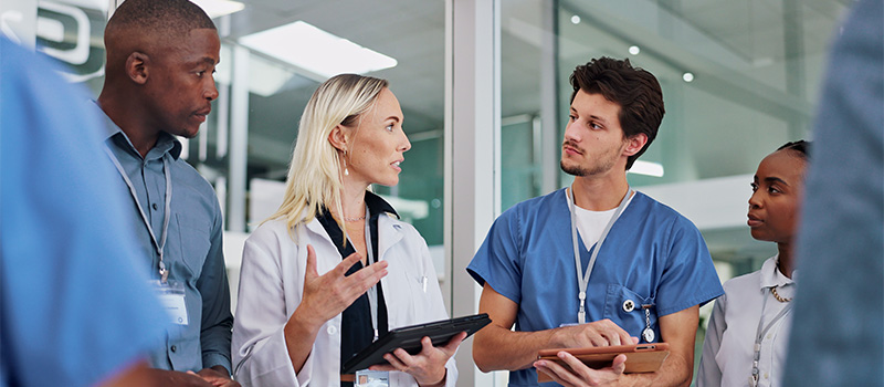 Diverse medical team discussing patient
